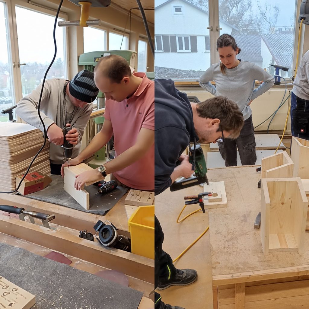 Personen arbeiten in einer Holzwerkstatt mit Werkzeugen und schauen beim Bau von Holzprojekten zu.