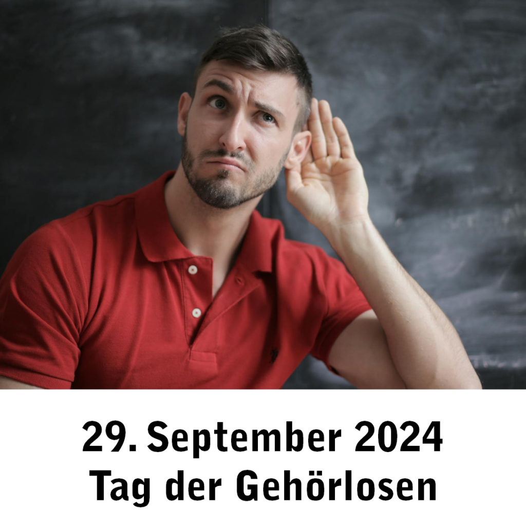 Mann in rotem Poloshirt hält Hand ans Ohr. Text: 29. September 2024 Tag der Gehörlosen.