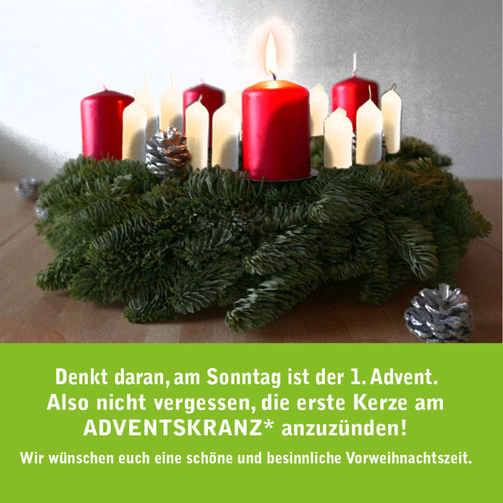 bild zeigt einen adventskranz mit einer brennenden kerze